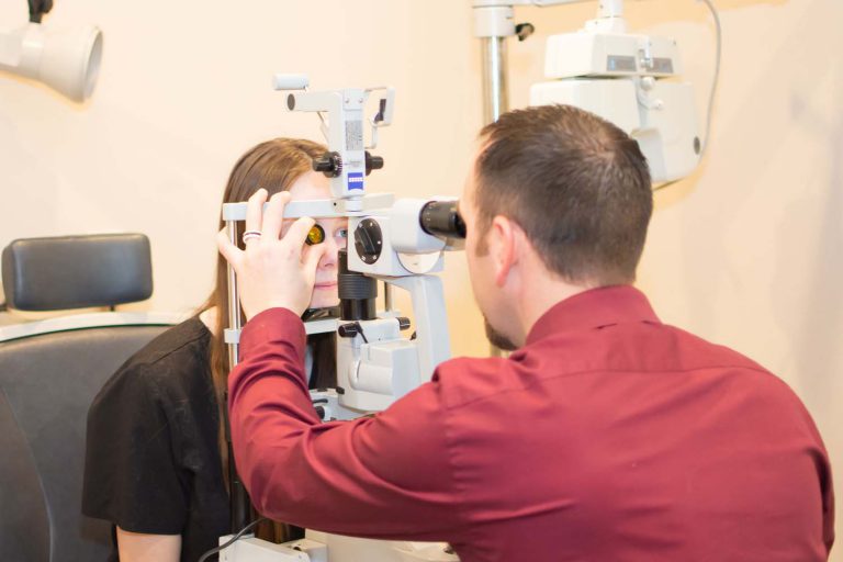 Doctor Seamons checking eye of patient